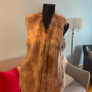 Dylan vest that is fur and creamy and soft. Never worn.